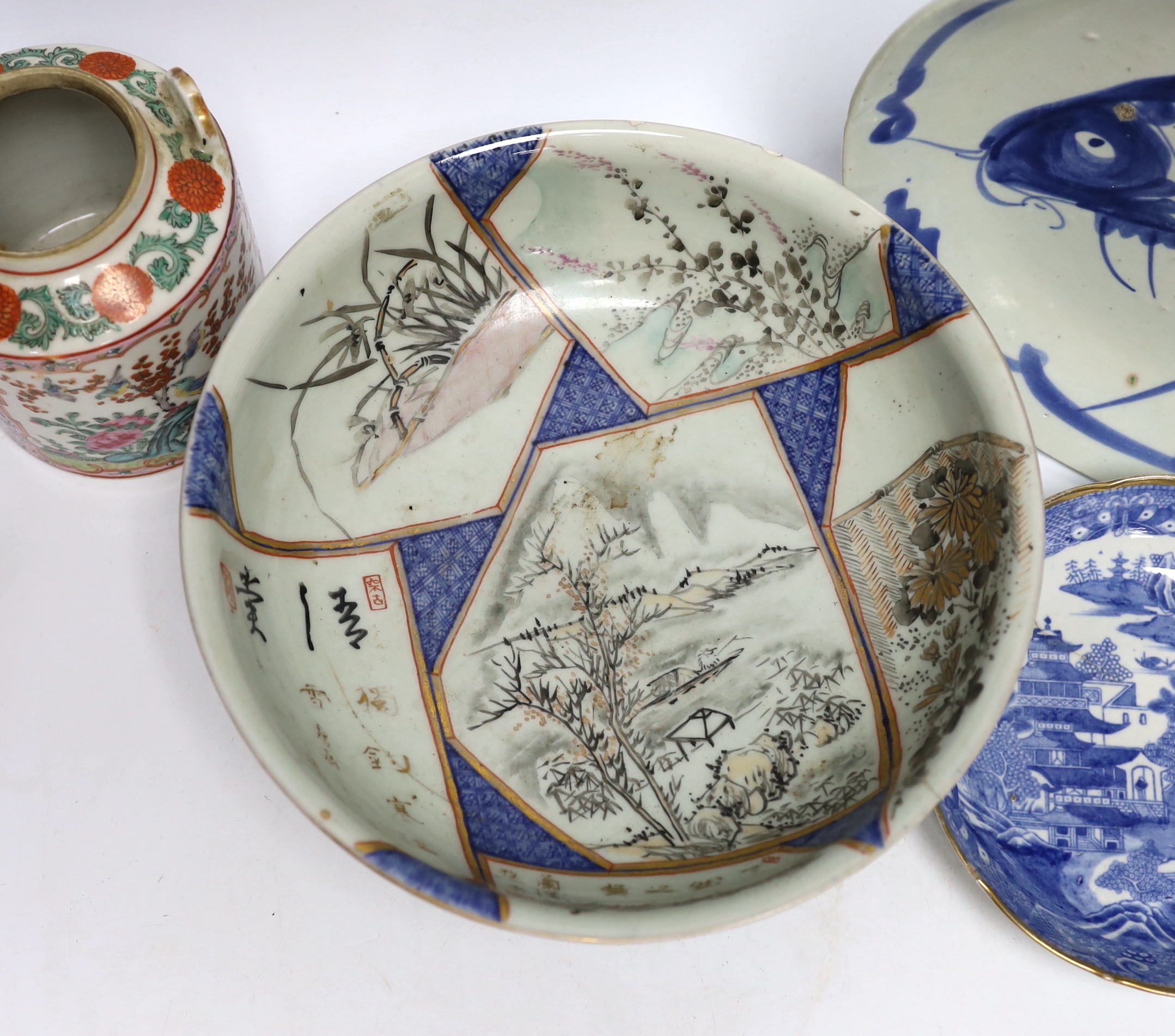 A Chinese famille rose teapot, a bowl and two dishes, bowl 24.5cm diameter